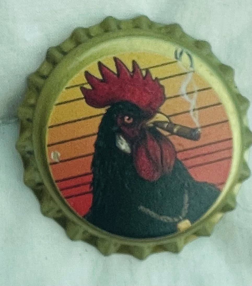 A gold bottlecap printed with a black rooster smoking a cigar against a sunset — Champ Chicharrón's personal mark.