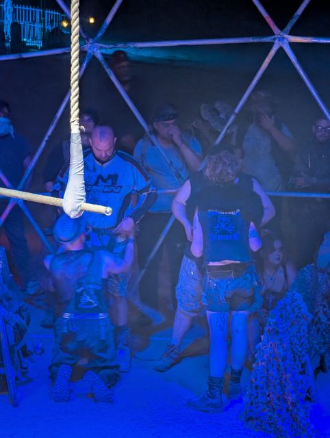 Two fighters face off under a rope rigging inside the Thunderdome.