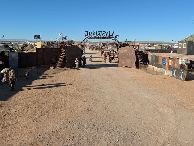 The Wasteland gate down a long empty street.